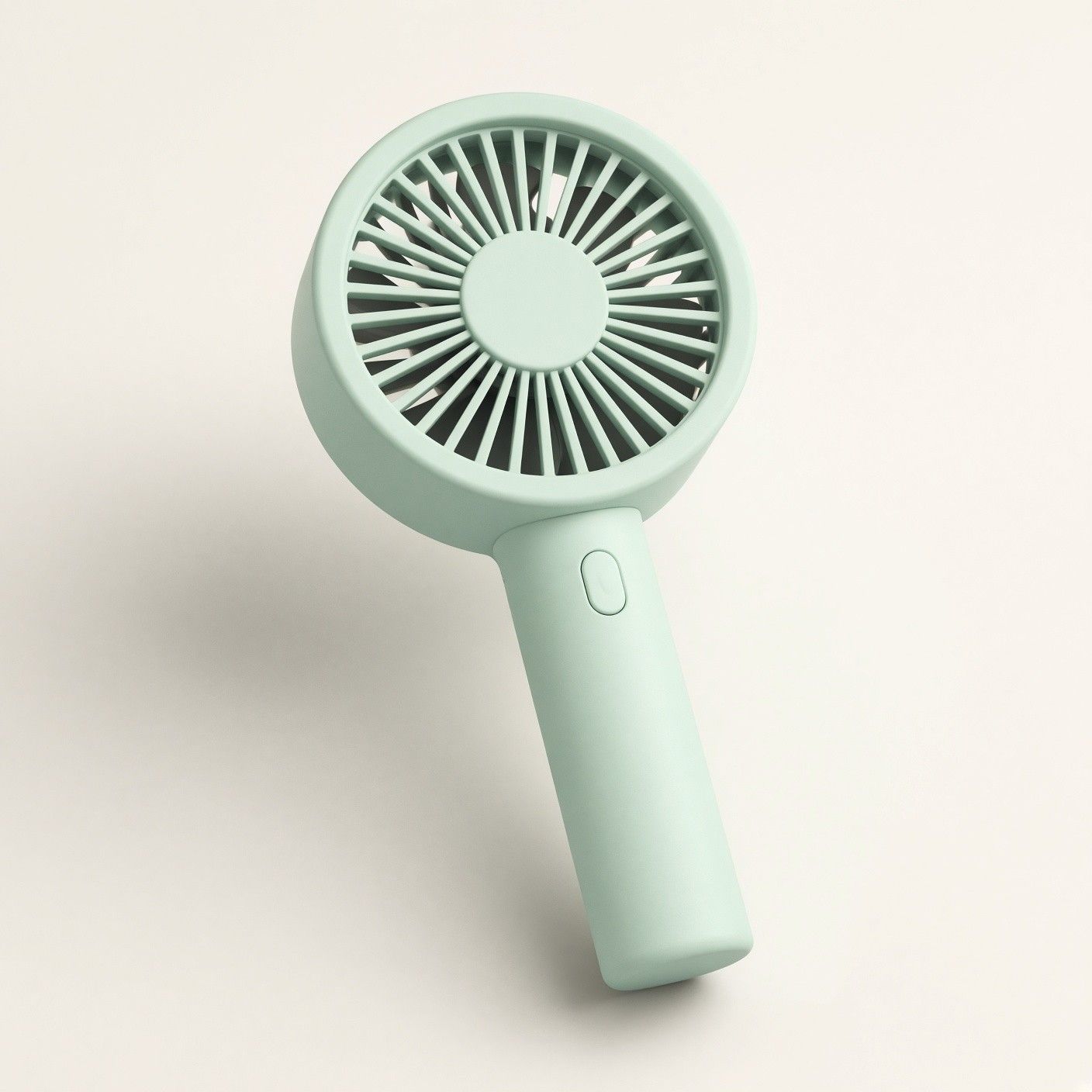 민트색 손풍기, 둥근 날개 머리와 버튼 하나 달린 손잡이